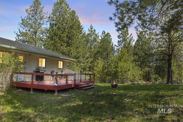 114 Par Dr, Cascade, ID 83611 - yard at dusk with a deck and a lawn