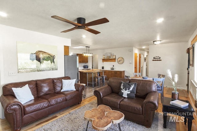 114 Par Dr, Cascade, ID 83611 - living area with light wood finished floors and ceiling fan