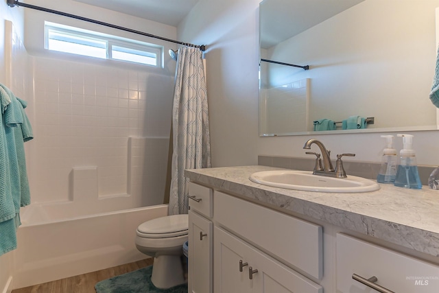 3539 W Zarea Dr, Meridian, ID 83642 - full bathroom featuring vanity, toilet, wood finished floors, and shower / tub combo