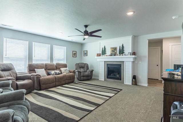 3539 W Zarea Dr, Meridian, ID 83642 - living area featuring visible vents, baseboards, ceiling fan, a large fireplace, and carpet