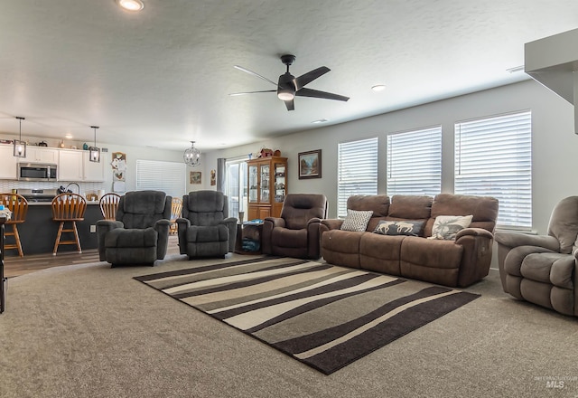 3539 W Zarea Dr, Meridian, ID 83642 - carpeted living area featuring recessed lighting and ceiling fan with notable chandelier
