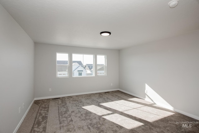 19361 James Ave, Caldwell, ID 83605 - carpeted empty room with baseboards