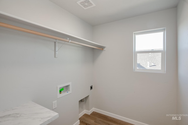 19361 James Ave, Caldwell, ID 83605 - clothes washing area with baseboards, visible vents, laundry area, electric dryer hookup, and washer hookup