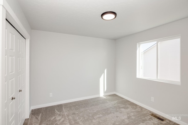 19361 James Ave, Caldwell, ID 83605 - unfurnished bedroom with visible vents, carpet floors, baseboards, and a closet