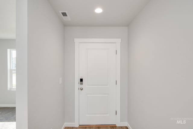 entryway with visible vents and baseboards