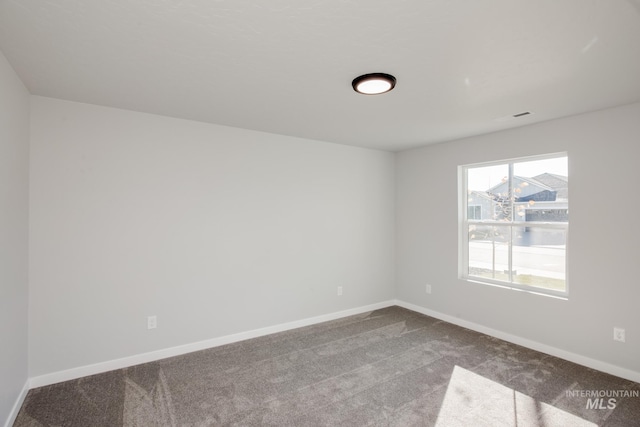 19361 James Ave, Caldwell, ID 83605 - empty room with baseboards and dark carpet