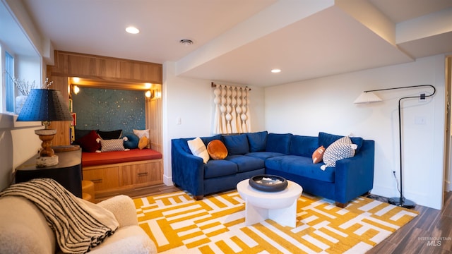 living area with recessed lighting and wood finished floors