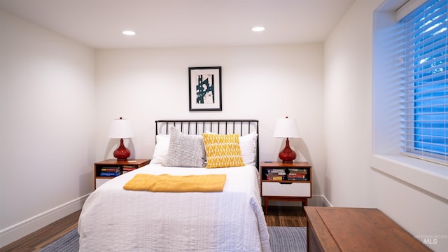 bedroom with recessed lighting, baseboards, and wood finished floors