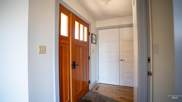 entrance foyer featuring dark wood finished floors and visible vents