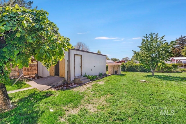 712 Yakima Ave, Filer, ID 83328 - view of yard featuring an outdoor structure and entry steps