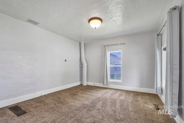 712 Yakima Ave, Filer, ID 83328 - carpeted empty room featuring a textured ceiling and baseboards
