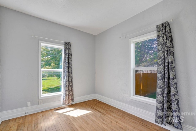 712 Yakima Ave, Filer, ID 83328 - unfurnished room with baseboards and hardwood / wood-style floors