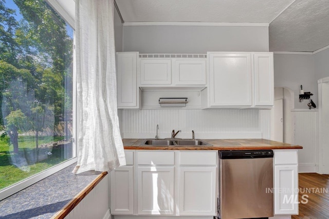 712 Yakima Ave, Filer, ID 83328 - kitchen with stainless steel dishwasher, a sink, ornamental molding, white cabinets, and a textured ceiling
