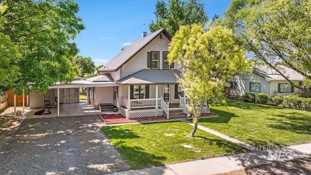 712 Yakima Ave, Filer, ID 83328 - view of front facade with covered porch, gravel driveway, and an attached carport