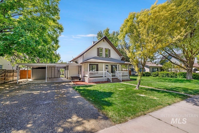 712 Yakima Ave, Filer, ID 83328 - view of front of property featuring a porch, a carport, and driveway