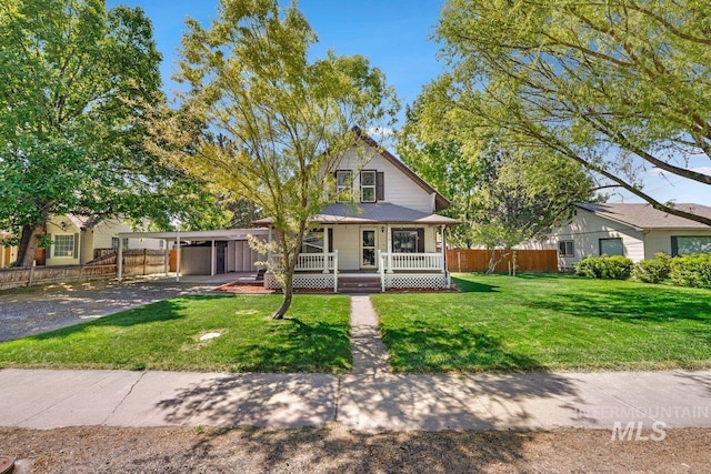 712 Yakima Ave, Filer, ID 83328 - view of front of home with covered porch, driveway, and a carport