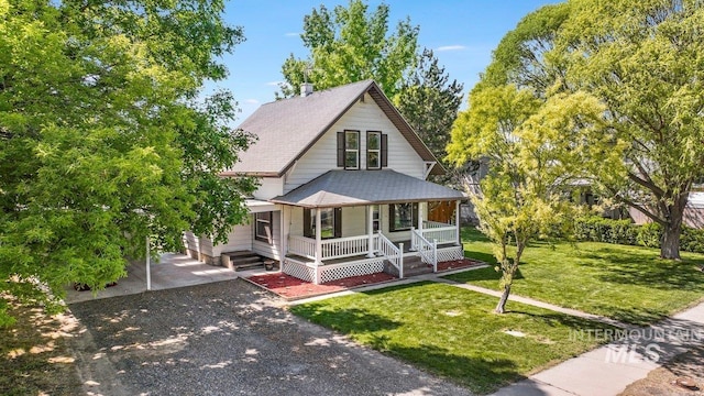 712 Yakima Ave, Filer, ID 83328 - view of front of house with a porch, a front lawn, roof with shingles, and dirt driveway