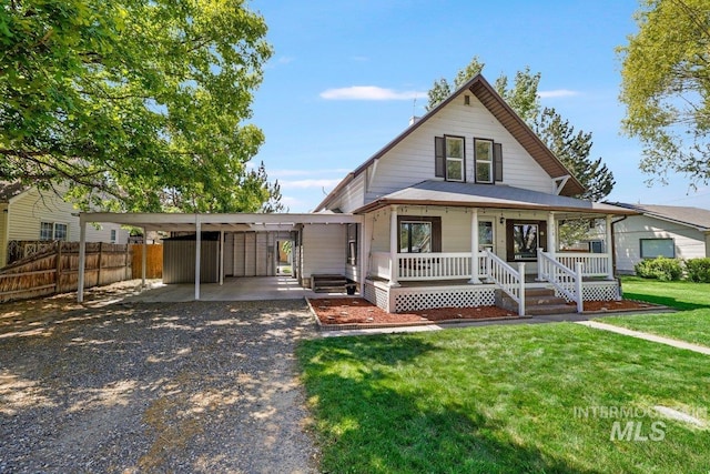 712 Yakima Ave, Filer, ID 83328 - view of front of property featuring gravel driveway, a carport, and covered porch
