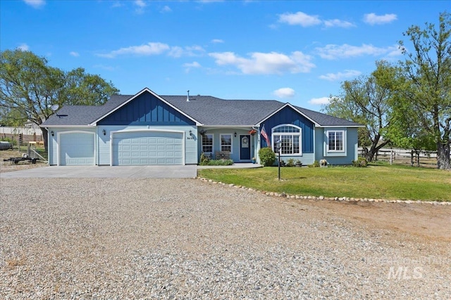 single story home featuring a garage, a front lawn, fence, board and batten siding, and driveway