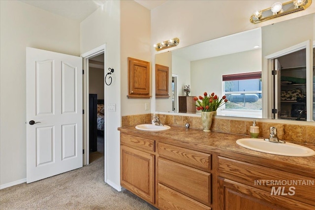 full bath with double vanity and a sink