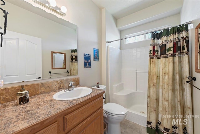 full bathroom featuring vanity, tile patterned floors, toilet, and a shower with shower curtain