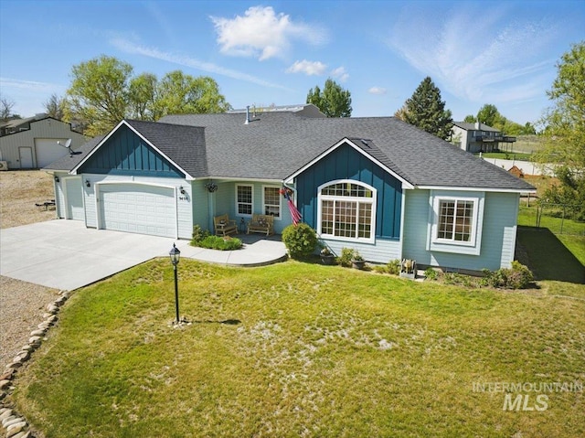 single story home with board and batten siding, an attached garage, and a front lawn