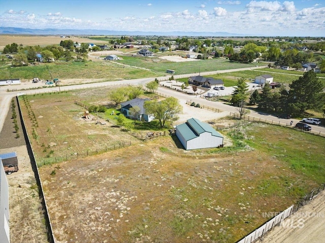 birds eye view of property featuring a rural view
