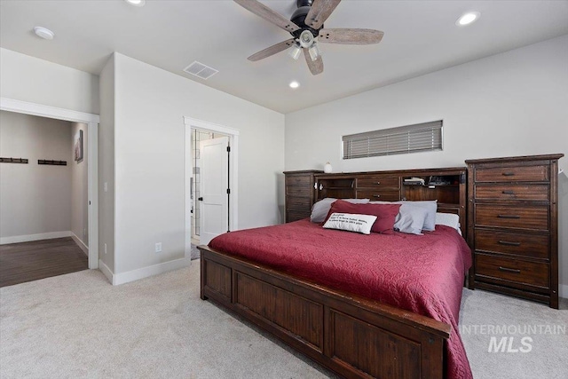 bedroom featuring ceiling fan, recessed lighting, light colored carpet, visible vents, and baseboards