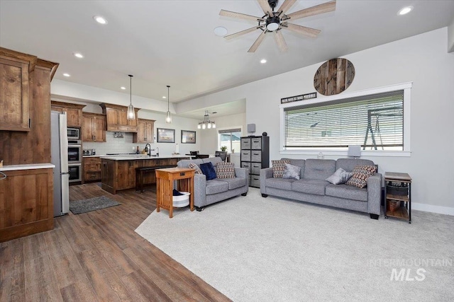 living room featuring recessed lighting and a healthy amount of sunlight