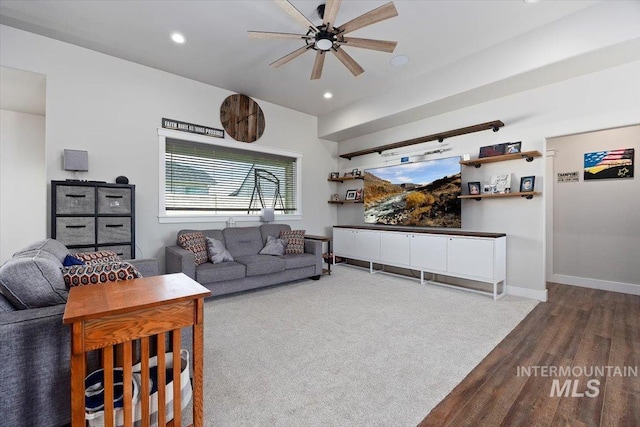 living area with baseboards, ceiling fan, wood finished floors, and recessed lighting