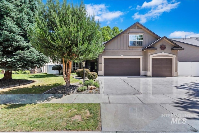 846 E Glacier Bay Ct, Meridian, ID 83642 - view of front of home with a garage, concrete driveway, a front yard, and board and batten siding