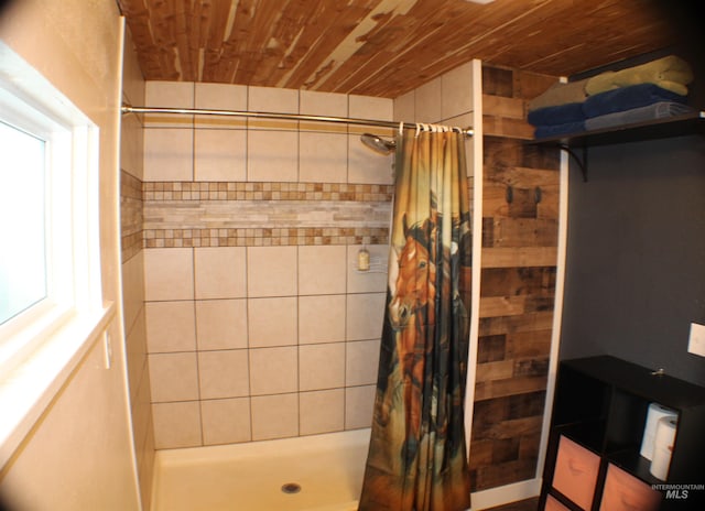 bathroom with plenty of natural light, wooden ceiling, and a shower with shower curtain