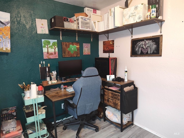 home office with hardwood / wood-style flooring