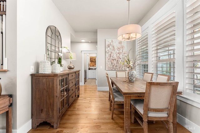 733 W Cowman St, Eagle, ID 83616 - dining space with light wood-type flooring and baseboards
