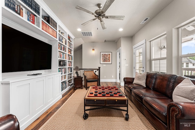 733 W Cowman St, Eagle, ID 83616 - living room with dark wood-type flooring, built in features, ceiling fan, and recessed lighting