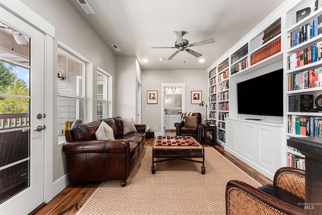 733 W Cowman St, Eagle, ID 83616 - living room featuring wood finished floors, a ceiling fan, and built in features