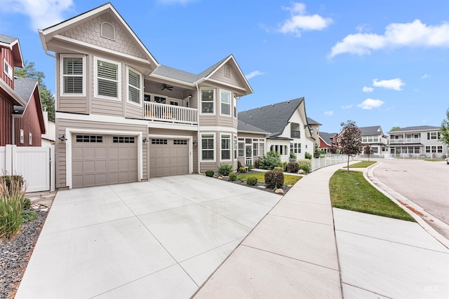 733 W Cowman St, Eagle, ID 83616 - victorian house featuring a balcony, a ceiling fan, a garage, driveway, and a residential view