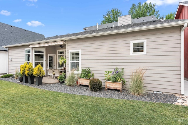 733 W Cowman St, Eagle, ID 83616 - rear view of house with a patio area, a lawn, ceiling fan, a chimney, and a shingled roof