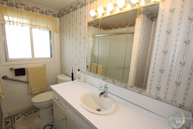7644 W Cambridge Dr, Boise, ID 83704 - full bath with a stall shower, vanity, and wallpapered walls
