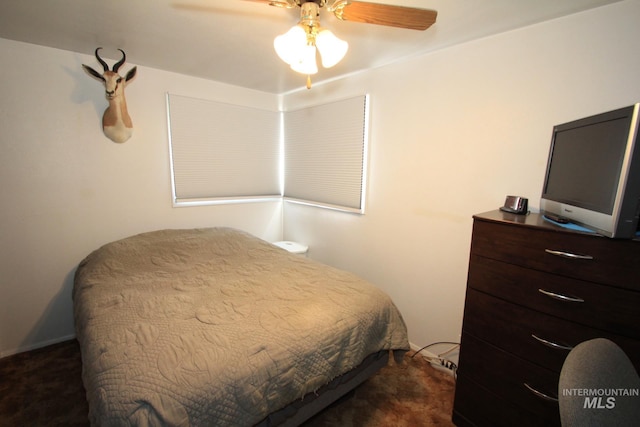 7644 W Cambridge Dr, Boise, ID 83704 - bedroom featuring dark colored carpet and a ceiling fan