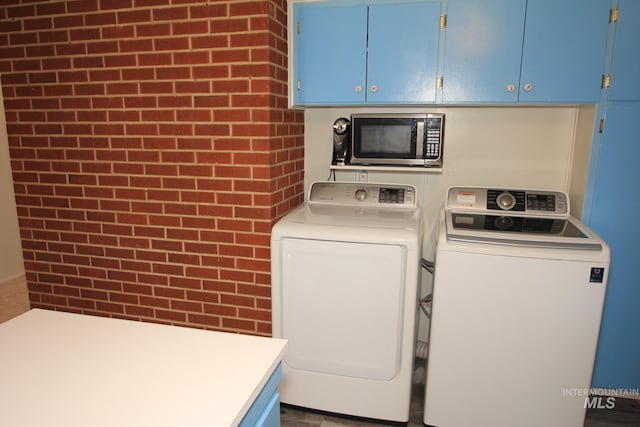 7644 W Cambridge Dr, Boise, ID 83704 - laundry area featuring separate washer and dryer and cabinet space