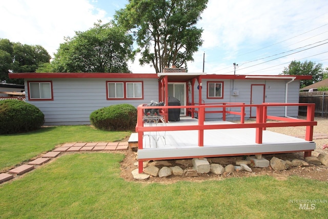 7644 W Cambridge Dr, Boise, ID 83704 - back of property with a wooden deck