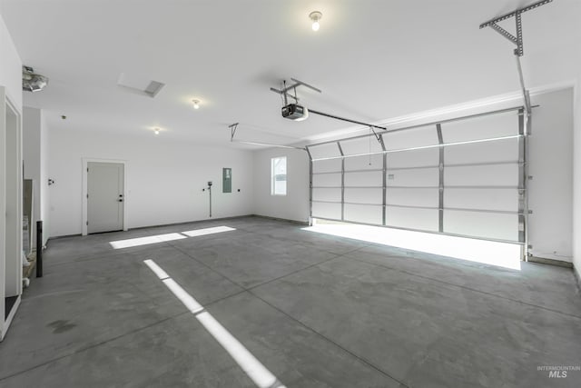 garage featuring a garage door opener and electric panel