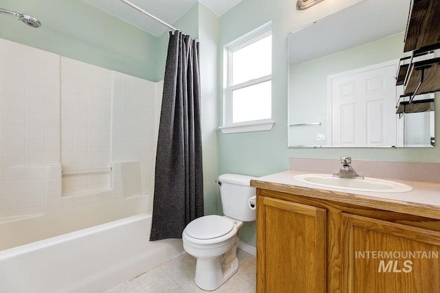 full bathroom with vanity, tile patterned flooring, toilet, shower / bath combo with shower curtain, and baseboards