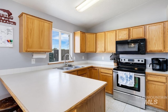kitchen with black microwave, a peninsula, stainless steel electric range oven, vaulted ceiling, and a sink