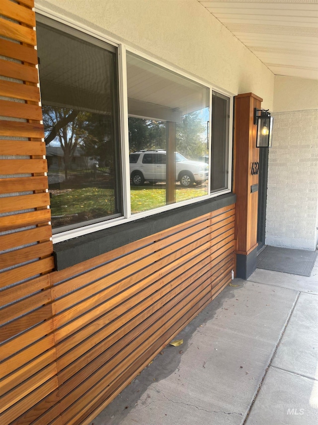 view of property exterior with covered porch