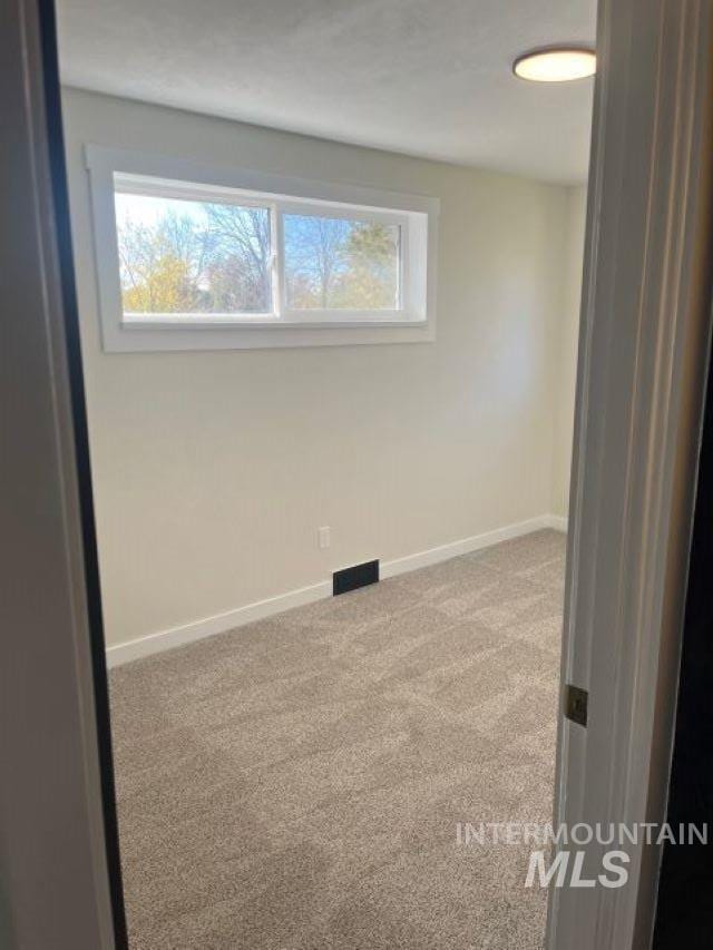 view of carpeted spare room