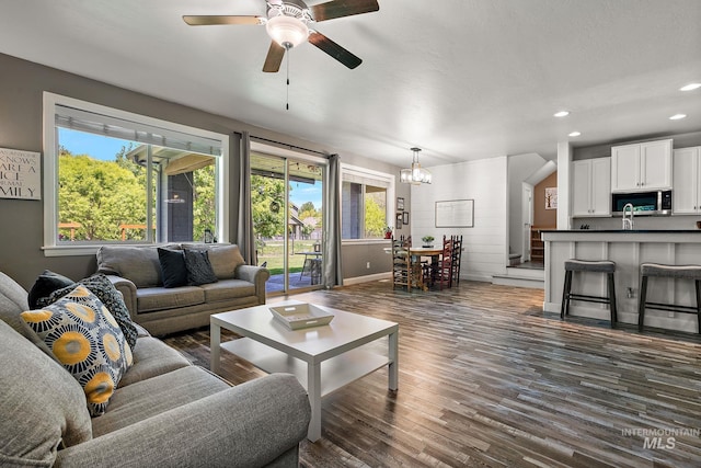 living room featuring dark wood-style flooring, plenty of natural light, recessed lighting, ceiling fan, and baseboards