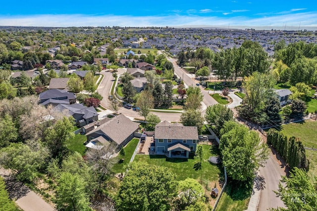 aerial view of property and surrounding area with nearby suburban area