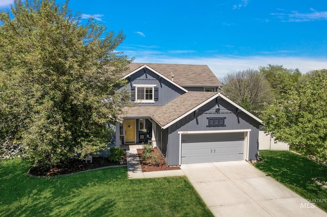 view of front facade with a garage, a front yard, concrete driveway, and board and batten siding
